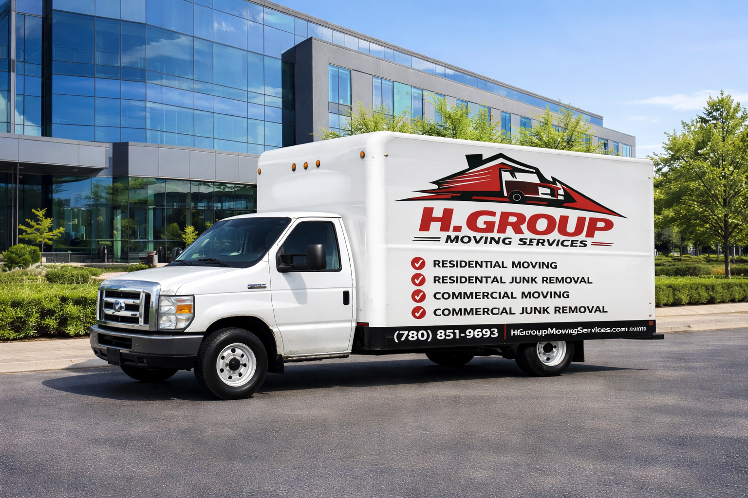 H. Group Moving Services truck parked at a commercial office building